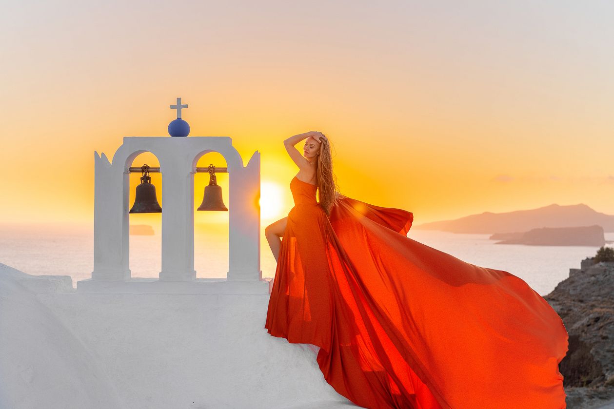 glamour flying dress photoshoot in Santorini Greece