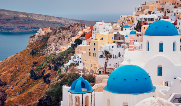 Oia village in Santorini with traditional blue roofs
